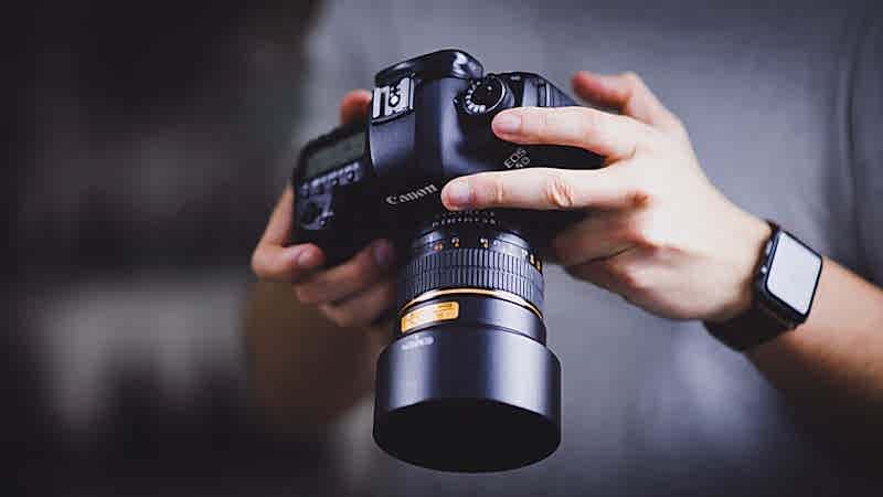 photographer holding canon