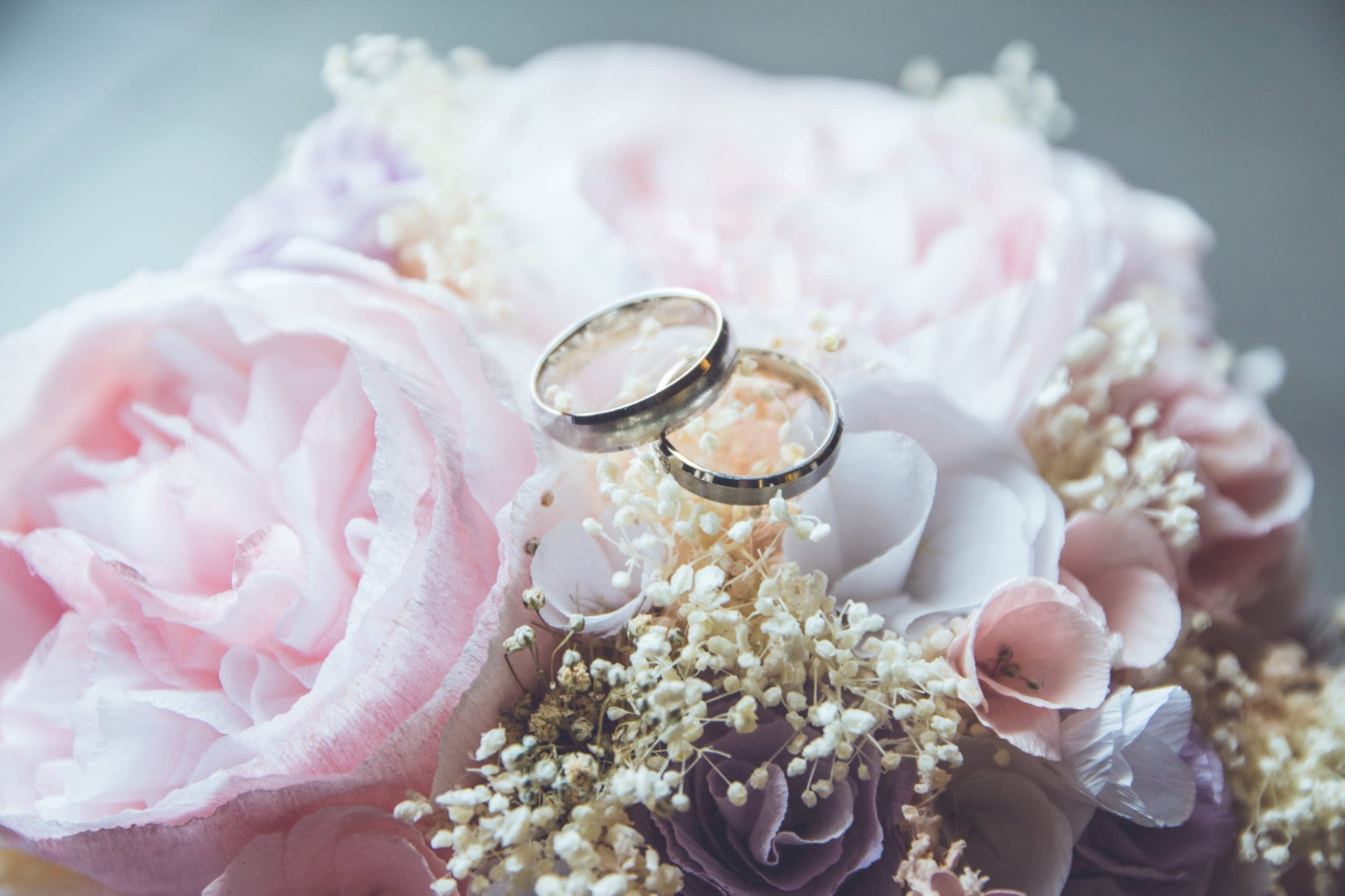 wedding rings on a flower piece