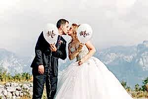 man and woman taking wedding photos